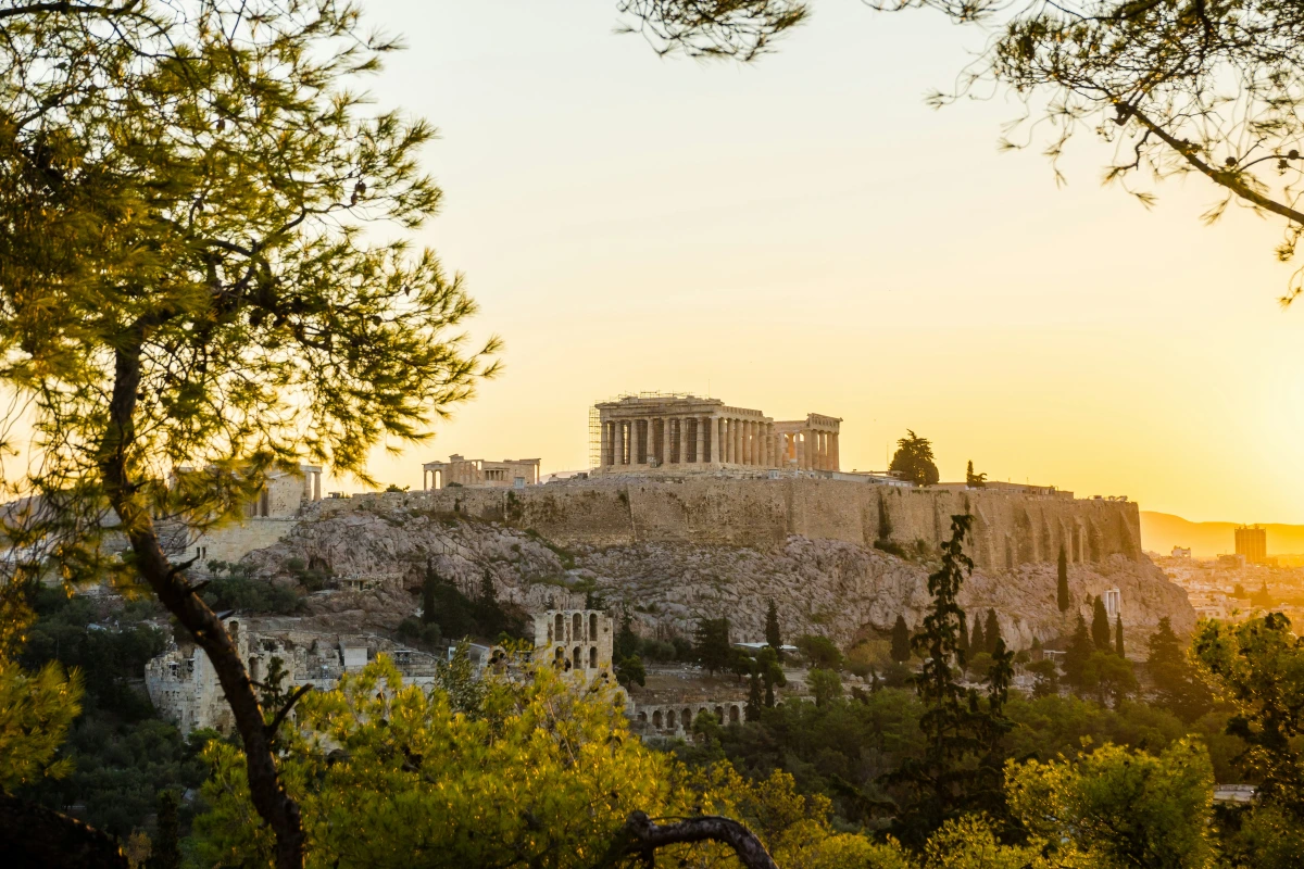the acropolis and parthenon in athens greece at sunset