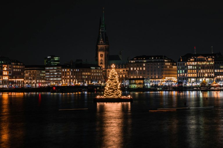 Festive Christmas tree lights sparkle in the heart of Hamburg, Germany's urban night scene.