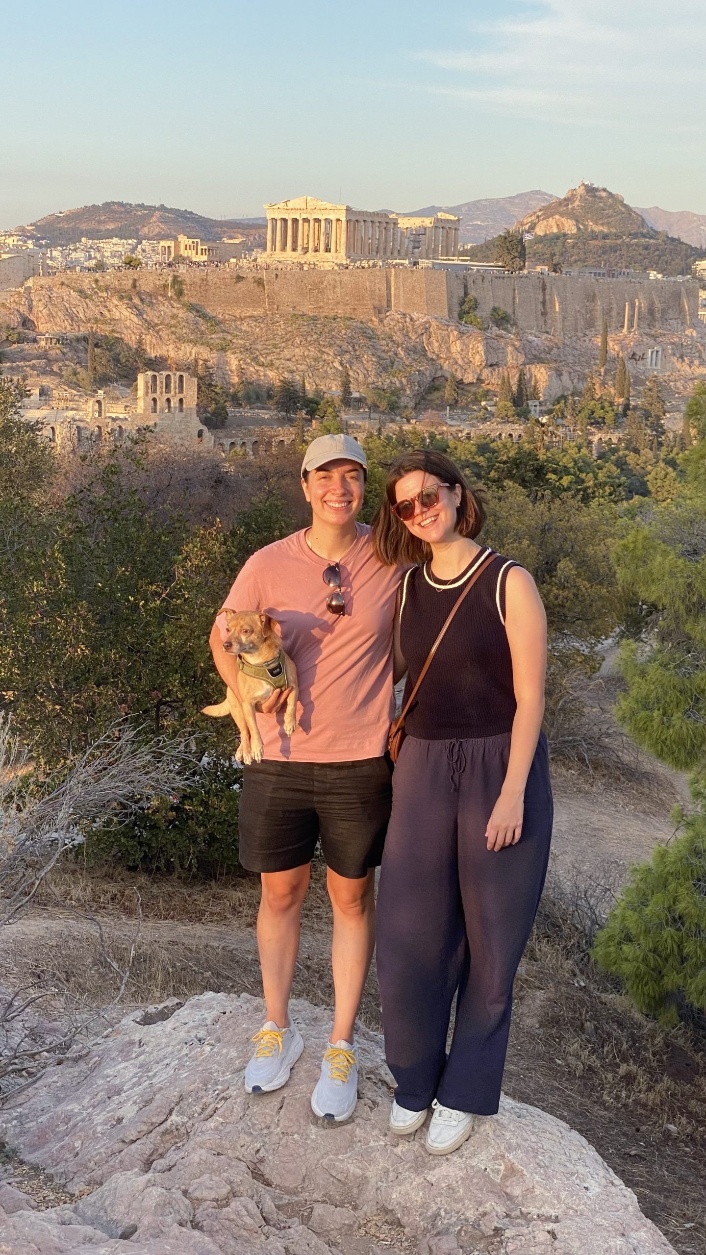 maria and olivia, content creators in athens in 2025 in front of the acropolis
