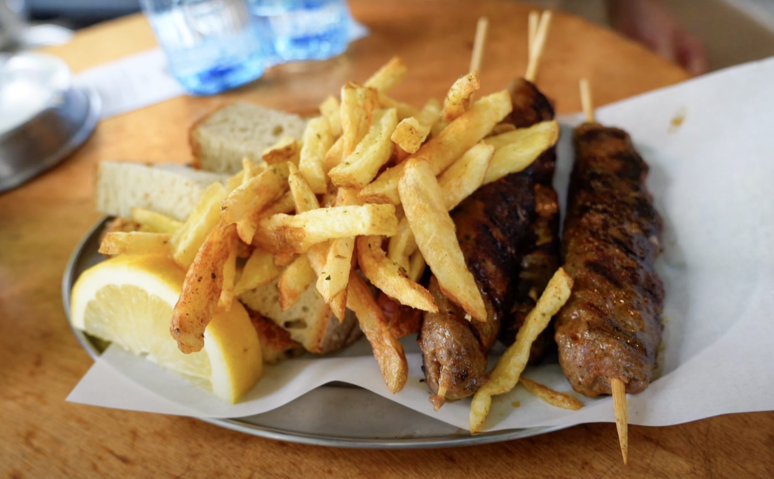 a plate of meat and fries from elvis souvlaki in pagrati athens in 2025