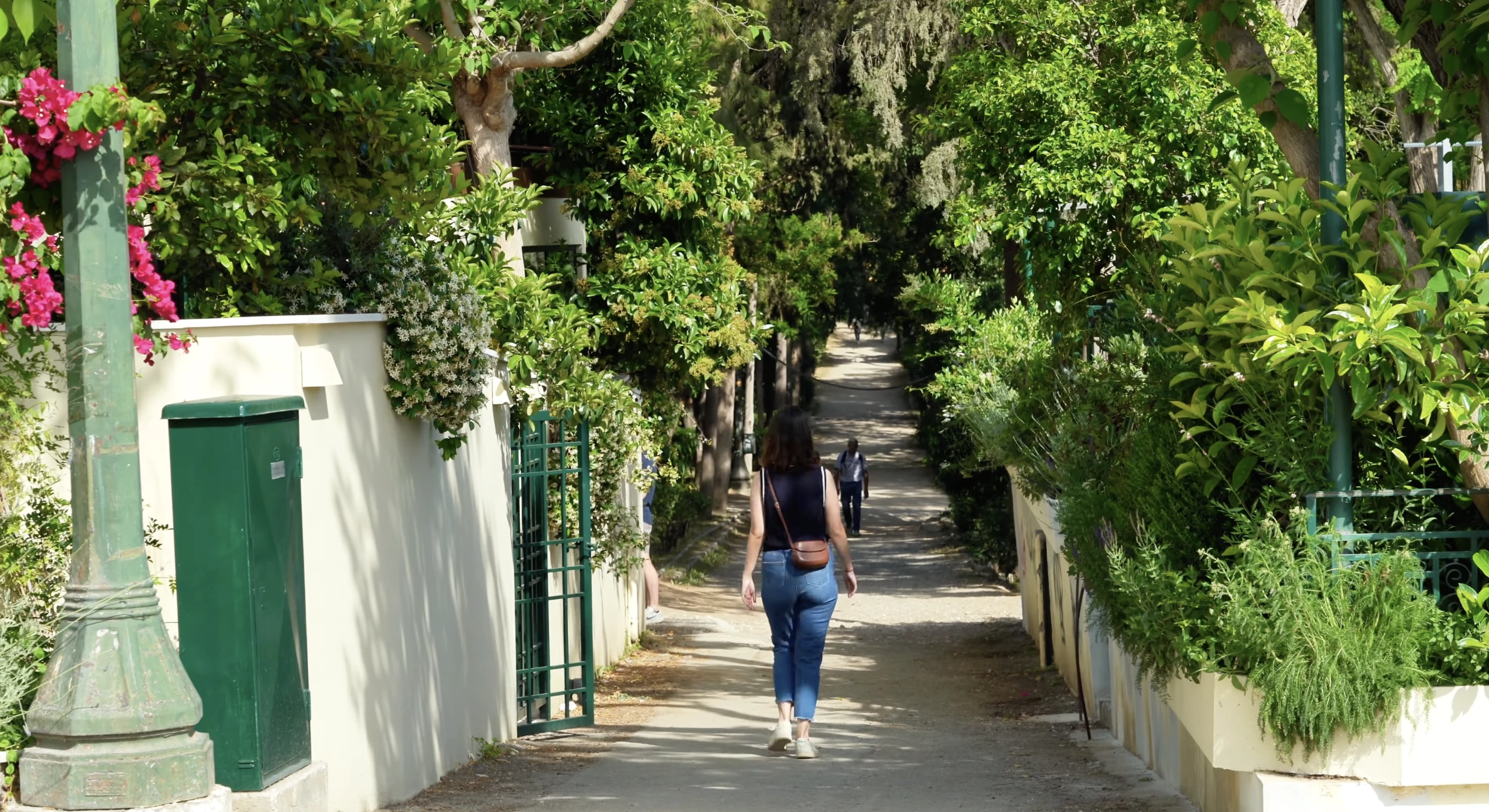 blogger/vlogger living in athens, olivia, walking through the greek national garden in athens