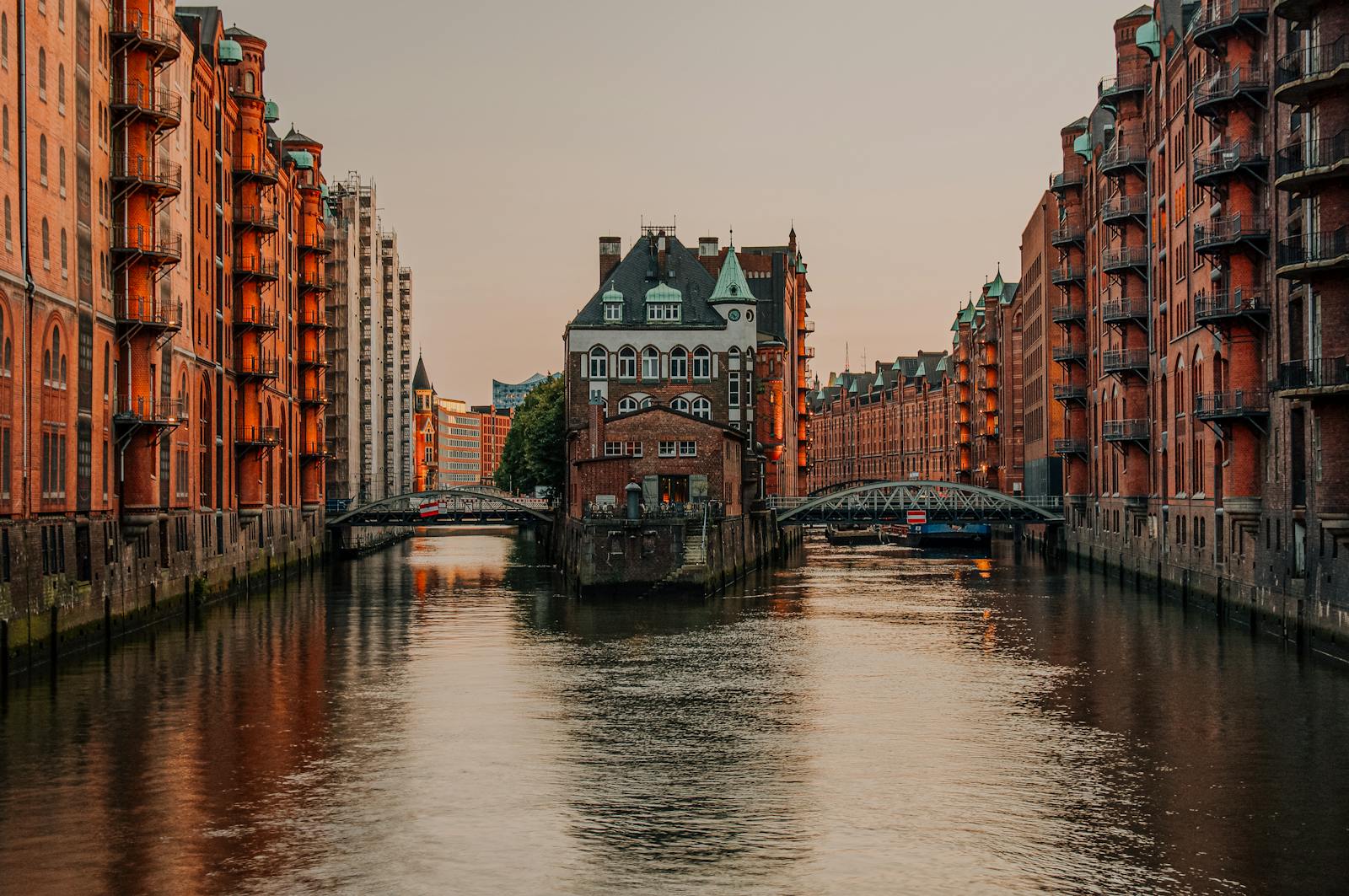 Captivating sunset over the historic Speicherstadt canal district in Hamburg, Germany.