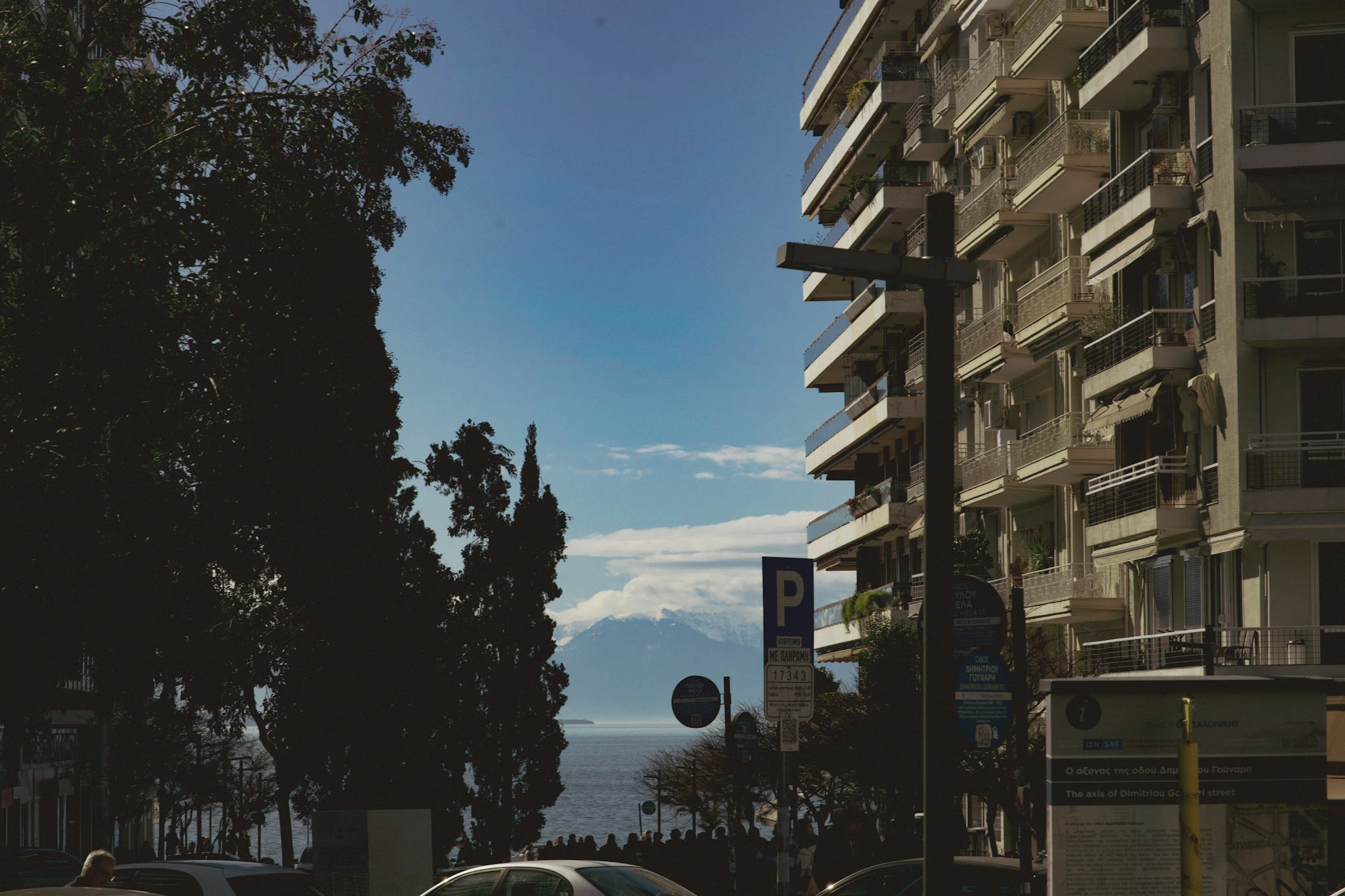 mount olympus poking out between the buildings in thessaloniki greece